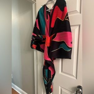 Worn 1 time -30 min photoshoot. Medium but can fit up to XL. Stretch & can belt